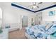 Bright bedroom features a tray ceiling, carpet flooring, coastal decor, and comfortable bed at 1715 Lake Egret Dr., North Myrtle Beach, SC 29582