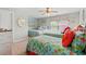 Bedroom with two beds, colorful comforters, and bright decor at 1715 Lake Egret Dr., North Myrtle Beach, SC 29582