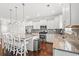 Modern kitchen featuring white cabinets, granite countertops, stainless steel appliances, and a center island at 1715 Lake Egret Dr., North Myrtle Beach, SC 29582