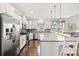Bright kitchen features stainless steel appliances, an island with seating, and light cabinets at 1715 Lake Egret Dr., North Myrtle Beach, SC 29582
