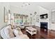 Bright living room features a fireplace, vaulted ceilings, stylish furniture, and hardwood floors at 1715 Lake Egret Dr., North Myrtle Beach, SC 29582