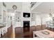 Cozy living room with fireplace, built-in shelving, hardwood floors, and lots of natural light at 1715 Lake Egret Dr., North Myrtle Beach, SC 29582