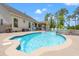 A backyard oasis featuring a sparkling pool, a spa, and outdoor seating area at 1715 Lake Egret Dr., North Myrtle Beach, SC 29582