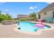 Sparkling pool features a pink flamingo floatie and is surrounded by lush landscaping at 1715 Lake Egret Dr., North Myrtle Beach, SC 29582