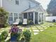 Landscaped back yard with patio, outdoor seating, and flower boxes at 185 Rocko Dr., Myrtle Beach, SC 29579