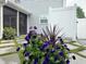 Close up of landscaping with an emphasis on the patio and picket fence beyond at 185 Rocko Dr., Myrtle Beach, SC 29579