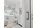 Bright bathroom features a soaking tub, neutral palette, and a glass-enclosed shower stall at 185 Rocko Dr., Myrtle Beach, SC 29579