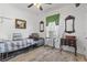 Inviting bedroom with wood floors, neutral tones, and a small reading chair at 185 Rocko Dr., Myrtle Beach, SC 29579