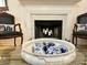 Close up of living room fireplace with matching chairs and decor at 185 Rocko Dr., Myrtle Beach, SC 29579