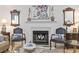 Living room fireplace and mantle with decorative lighting and mirrors at 185 Rocko Dr., Myrtle Beach, SC 29579