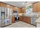 Updated kitchen with stainless steel appliances, light backsplash and hardwood cabinets and floors at 185 Rocko Dr., Myrtle Beach, SC 29579