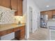 Bright kitchen with light countertops, stainless steel appliances, custom backsplash and nearby storage at 185 Rocko Dr., Myrtle Beach, SC 29579