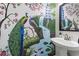 Unique powder room with hand-painted mural featuring peacocks and a pagoda at 185 Rocko Dr., Myrtle Beach, SC 29579