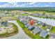 An aerial perspective showcasing the home's location within a neighborhood near a tranquil pond at 1898 Moonseed Dr., Longs, SC 29568