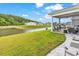 View of the property's backyard and pond from the screened in porch at 1898 Moonseed Dr., Longs, SC 29568