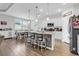 Open kitchen with island, modern appliances, and plenty of counter space for cooking and entertaining at 1898 Moonseed Dr., Longs, SC 29568