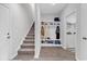 Functional mud room with storage shelves, coat hooks, and convenient access to laundry and garage at 1898 Moonseed Dr., Longs, SC 29568