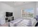 Bright bedroom featuring a ceiling fan, window, and television at 2005 Silvercrest Dr. # 32F, Myrtle Beach, SC 29579