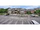 Exterior view of the building, with parking and limited landscaping at 2005 Silvercrest Dr. # 32F, Myrtle Beach, SC 29579