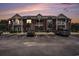 Attractive brick condo building at dusk with manicured landscaping and ample parking at 2005 Silvercrest Dr. # 32F, Myrtle Beach, SC 29579