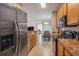 Well-lit kitchen featuring stainless steel appliances and dining area in background at 2005 Silvercrest Dr. # 32F, Myrtle Beach, SC 29579