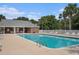 Community swimming pool with palm trees and covered sitting area at 2005 Silvercrest Dr. # 32F, Myrtle Beach, SC 29579