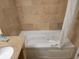 Spa-like bathroom with a soaking tub featuring jets, tile surround, and vanity at 201 S Ocean Blvd. # 205, Myrtle Beach, SC 29577