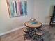 Cozy dining area with seating for four next to a modern art piece at 201 S Ocean Blvd. # 205, Myrtle Beach, SC 29577