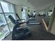 Gym area with various exercise equipment and large windows offering natural light at 201 S Ocean Blvd. # 205, Myrtle Beach, SC 29577