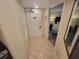 Hallway leading to a bedroom with a door on the left and a mirror on the right at 201 S Ocean Blvd. # 205, Myrtle Beach, SC 29577
