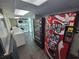 Laundry room with multiple washing machines, vending machine, and snack machine at 201 S Ocean Blvd. # 205, Myrtle Beach, SC 29577