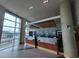 Bright lobby featuring a front desk, mosaic wall art, and expansive windows with views at 201 S Ocean Blvd. # 205, Myrtle Beach, SC 29577