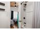 Bathroom with black hardware and shower with view to a bedroom with two twin beds at 204 55Th Ave. N, North Myrtle Beach, SC 29582