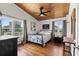 Bedroom with light wood-paneled ceilings, two windows and neutral furniture providing a comfortable space at 204 55Th Ave. N, North Myrtle Beach, SC 29582