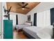 Bedroom featuring two twin beds, a ceiling fan, and a wooden paneled ceiling at 204 55Th Ave. N, North Myrtle Beach, SC 29582