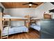Bunk room featuring two sets of wooden bunk beds and wood paneled ceiling and walls at 204 55Th Ave. N, North Myrtle Beach, SC 29582