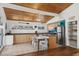 Kitchen with wood ceiling, island with eat in space and appliances offering an open entertaining space at 204 55Th Ave. N, North Myrtle Beach, SC 29582