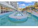 Lazy river with a bridge, lush palm trees and building in the background at 2300 N Ocean Blvd. # 132, Myrtle Beach, SC 29577