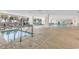 Large indoor pool area with lounge chairs and palm tree views, providing a relaxing atmosphere at 2300 N Ocean Blvd. # 132, Myrtle Beach, SC 29577