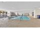 Indoor pool with lounge chairs and palm tree views, perfect for year-round enjoyment at 2300 N Ocean Blvd. # 132, Myrtle Beach, SC 29577