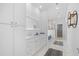 Spacious bathroom featuring double vanity, modern lighting, and marble floors at 2313 Summersweet Ln., Myrtle Beach, SC 29579
