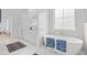 Elegant bathroom featuring a soaking tub, marble tile, and modern fixtures at 2313 Summersweet Ln., Myrtle Beach, SC 29579