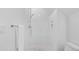 Modern shower with white tile, updated fixtures, and a recessed shelf at 2313 Summersweet Ln., Myrtle Beach, SC 29579