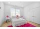 Bright bedroom featuring hardwood floors, natural light and a pink rug at 2313 Summersweet Ln., Myrtle Beach, SC 29579