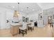 Stylish kitchen with stainless steel appliances, spacious island with seating, and custom cabinets and lighting at 2313 Summersweet Ln., Myrtle Beach, SC 29579