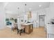 Beautiful kitchen featuring a large center island, white cabinets, pendant lighting, and modern appliances at 2313 Summersweet Ln., Myrtle Beach, SC 29579