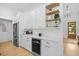 Open kitchen area with stainless steel appliances, custom cabinetry, and a built-in wine cooler for entertaining at 2313 Summersweet Ln., Myrtle Beach, SC 29579