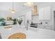 Kitchen with white countertops, island with barstool seating, pendant lighting, and modern fixtures at 2313 Summersweet Ln., Myrtle Beach, SC 29579