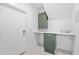 Clean laundry room with modern cabinets, white quartz countertops, and ample storage at 2313 Summersweet Ln., Myrtle Beach, SC 29579