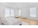 Airy main bedroom showcasing large windows, tray ceilings, and hardwood floors at 2313 Summersweet Ln., Myrtle Beach, SC 29579